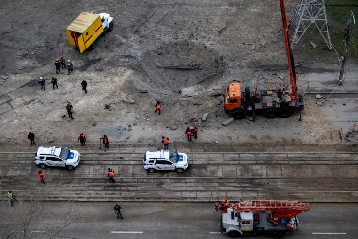 Energy supply workers restore a high-voltage line destroyed in Russian missile attack.