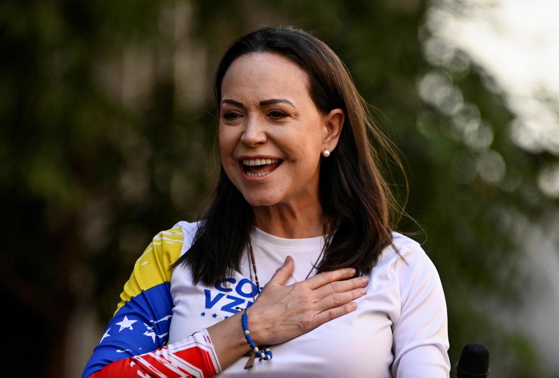 Venezuelan opposition leader María Corina Machado gestures at a protest.