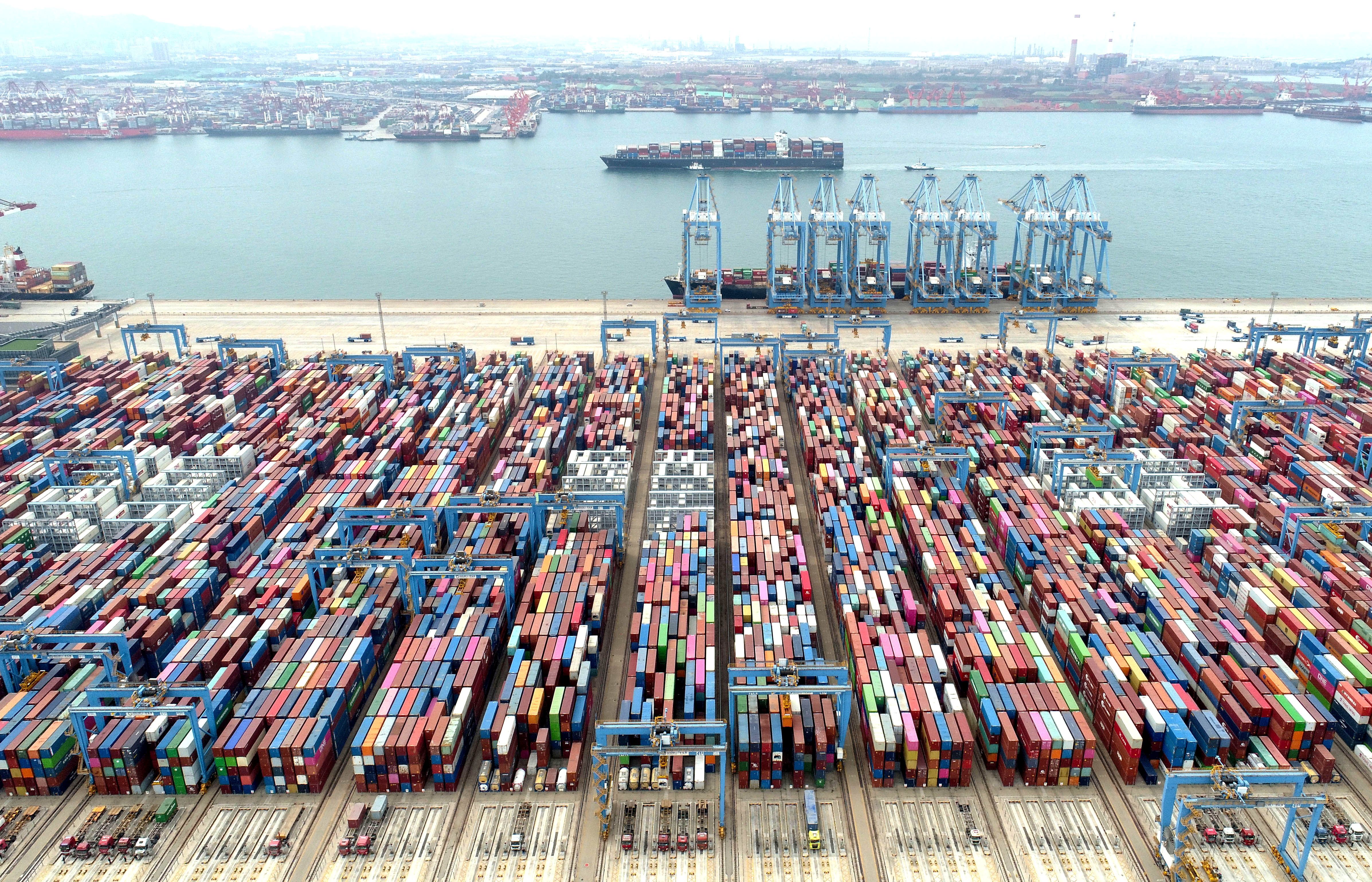 An aerial view shows containers and cargo vessels at the Qingdao port in Shandong province