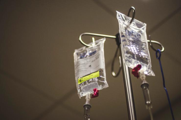 Chemotherapy drugs hang on on a hospital IV pole.