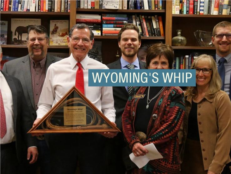 Sen. John Barrasso holds a whip he received from constituents