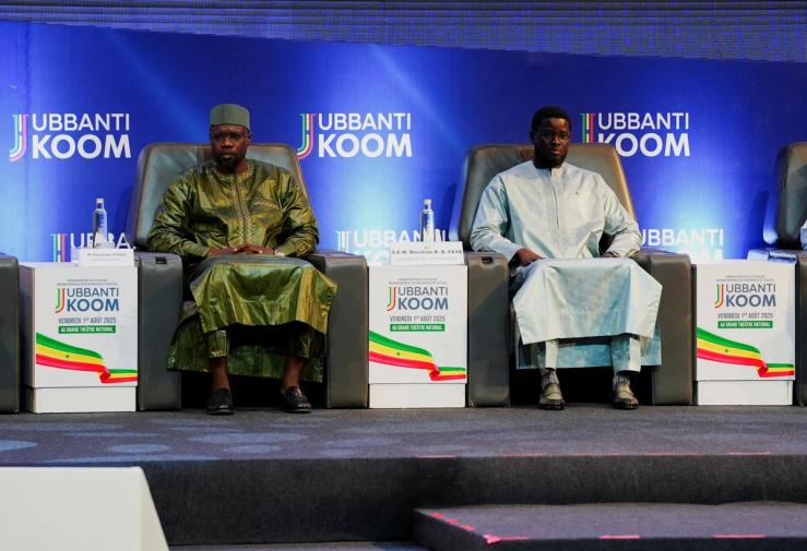 Senegal’s fomer Prime Minister Ousmane Sonko sits with Senegal’s President Bassirou Diomaye Faye.