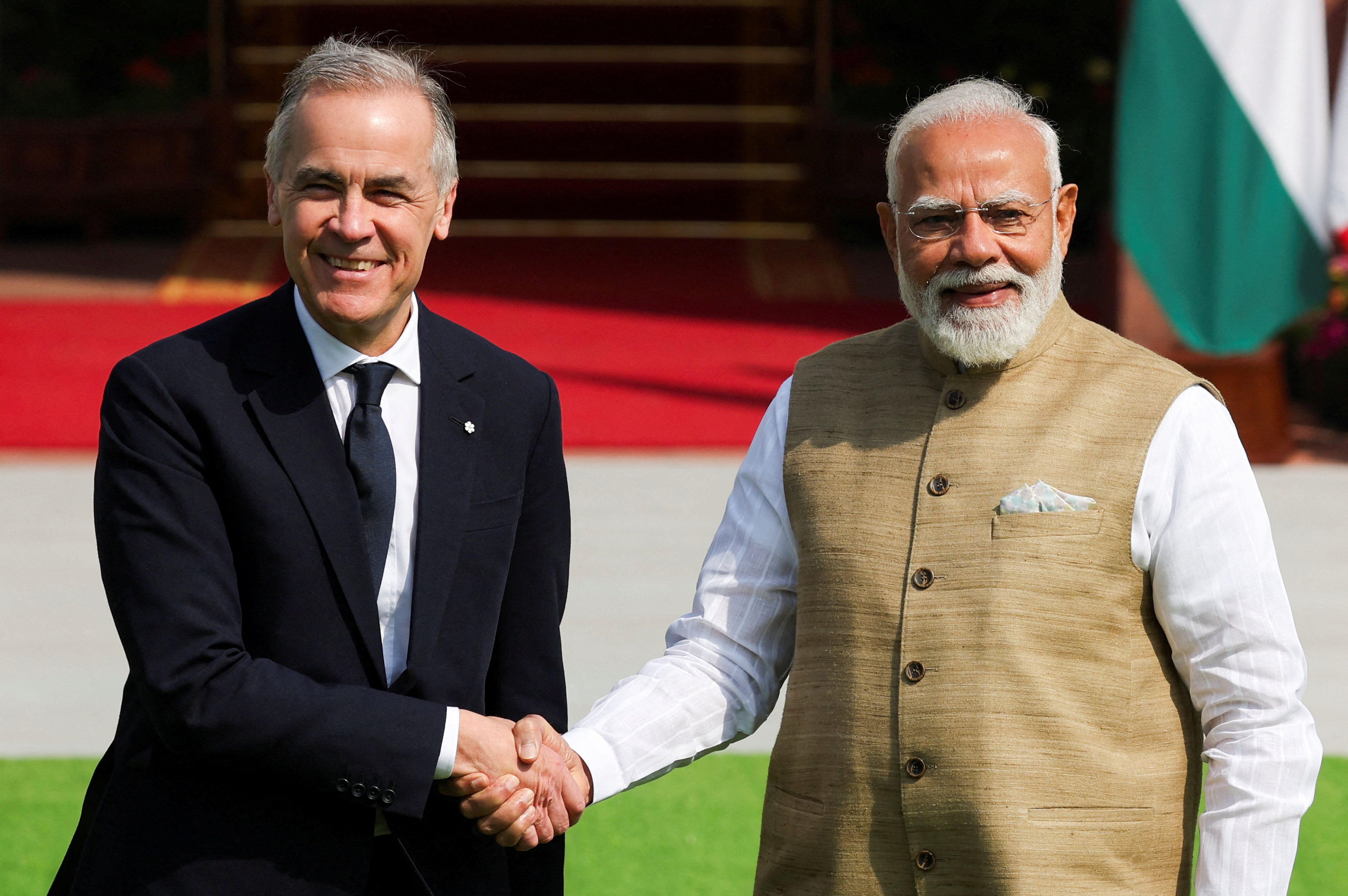 Canada’s Prime Minister Mark Carney shakes hands with his Indian counterpart, Narendra Modi.