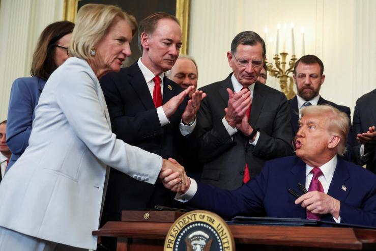 President Trump shakes hands with Sen. Shelley Moore Capito, R-W. Va., at an event in June.