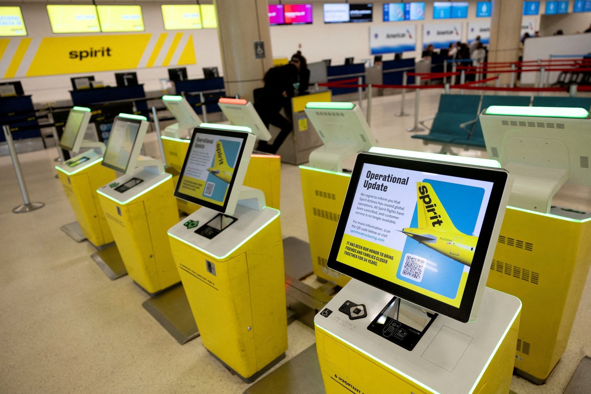 Self-check-in kiosks at Luis Munoz Marin International Airport display an “Operational Update” message after Spirit Airlines announced it was ceasing operations early Saturday amid an impasse in talks with some creditors over a $500 million government bailout plan, in Carolina, Puerto Rico