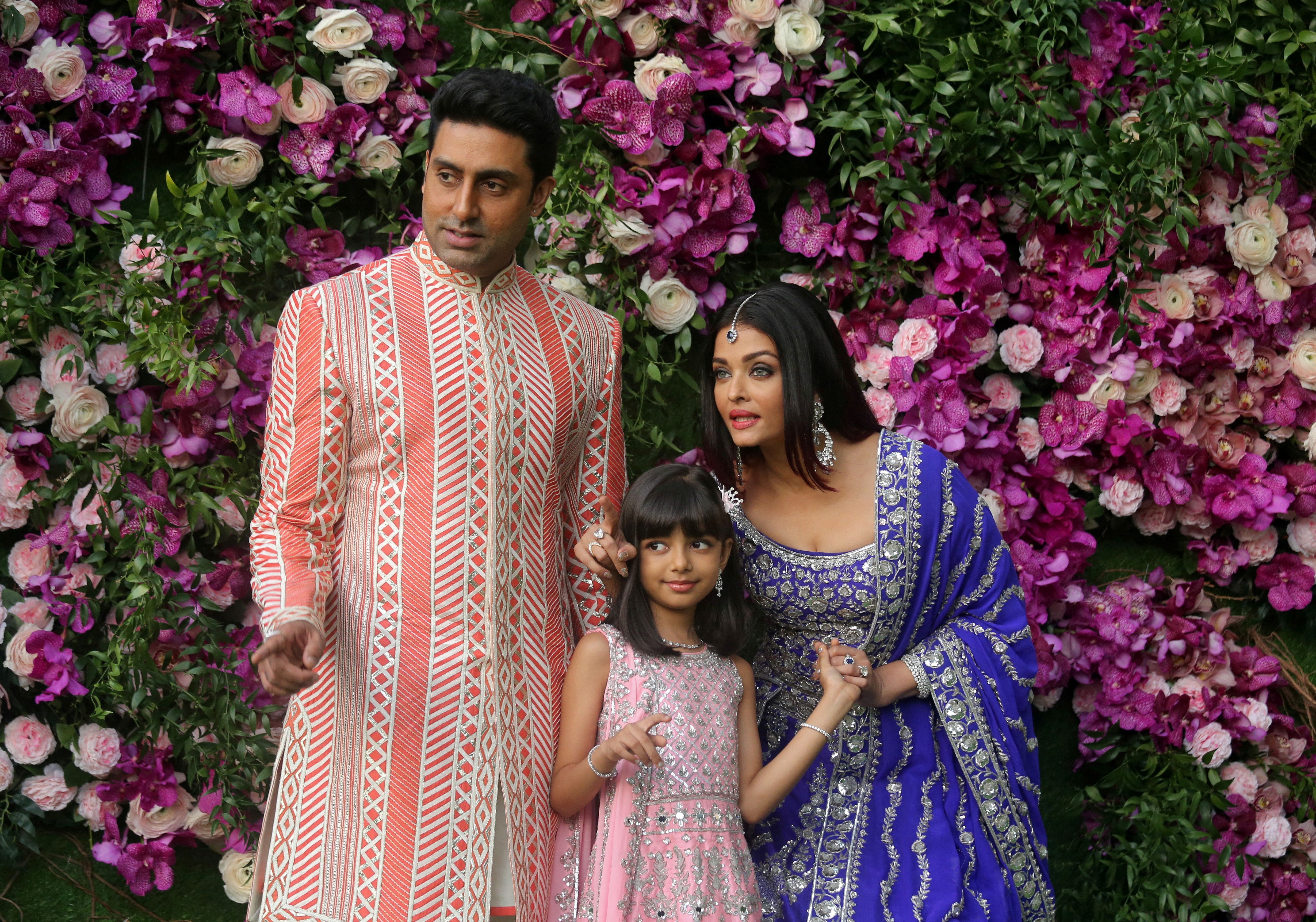 Actor Abhishek Bachchan, his wife actress Aishwarya Rai and their daughter Aaradhya pose during a photo opportunity at the wedding ceremony of Akash Ambani, son of the Chairman of Reliance Industries Mukesh Ambani, at Bandra-Kurla Complex in Mumbai, India.
