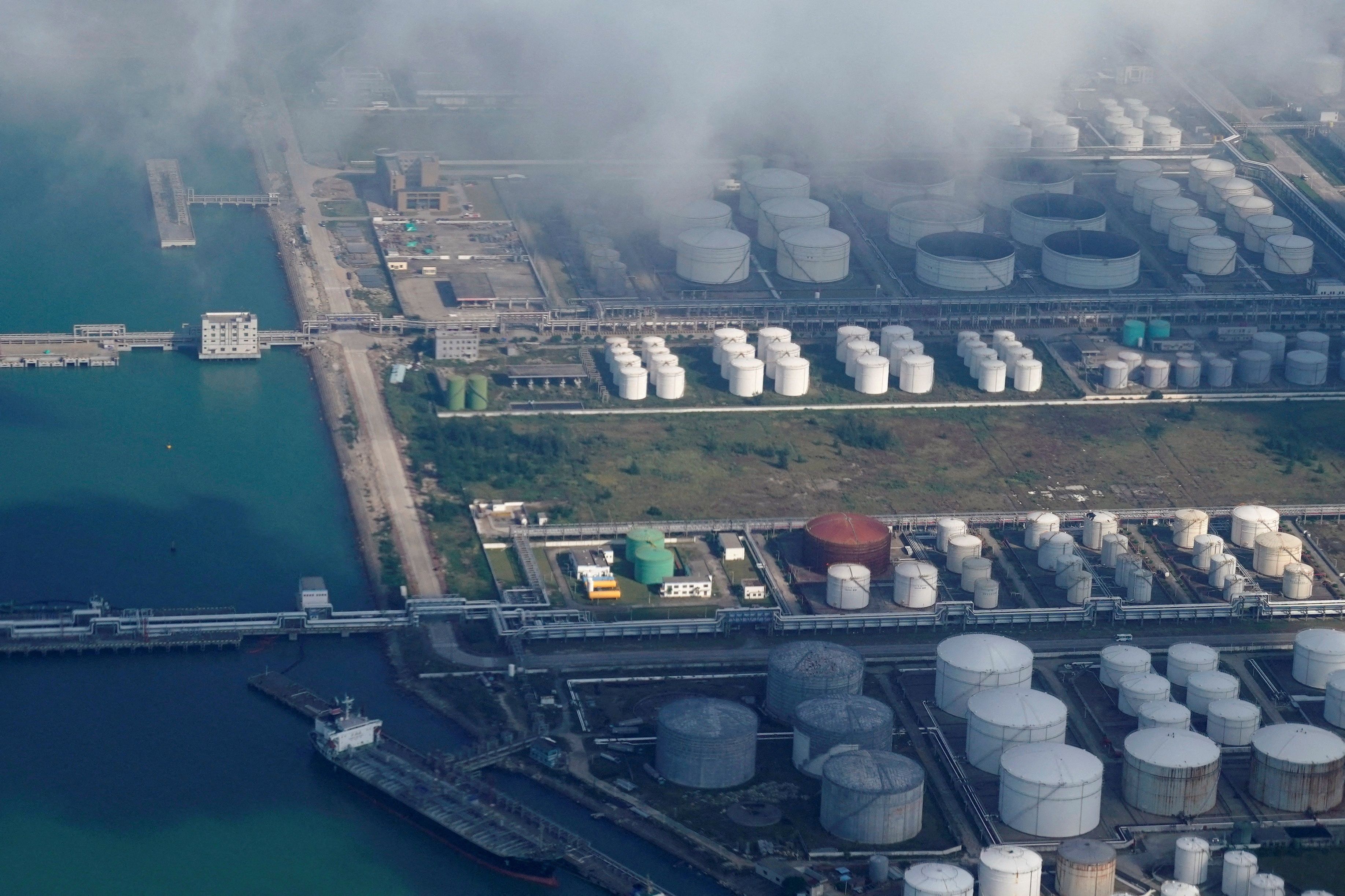  Oil and gas tanks are seen at an oil warehouse at a port in Zhuhai, China.