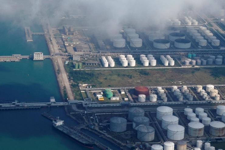 Oil and gas tanks are seen at an oil warehouse at a port in Zhuhai, China.