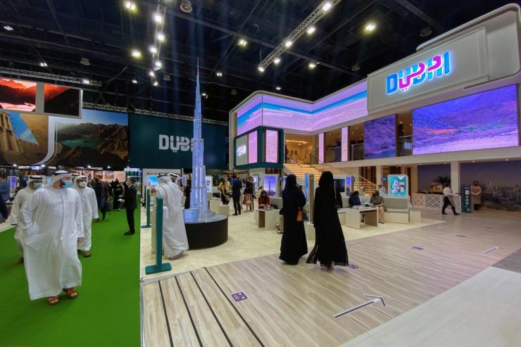 Visitors walk at the Arabian Travel Market in Dubai Trade Center.