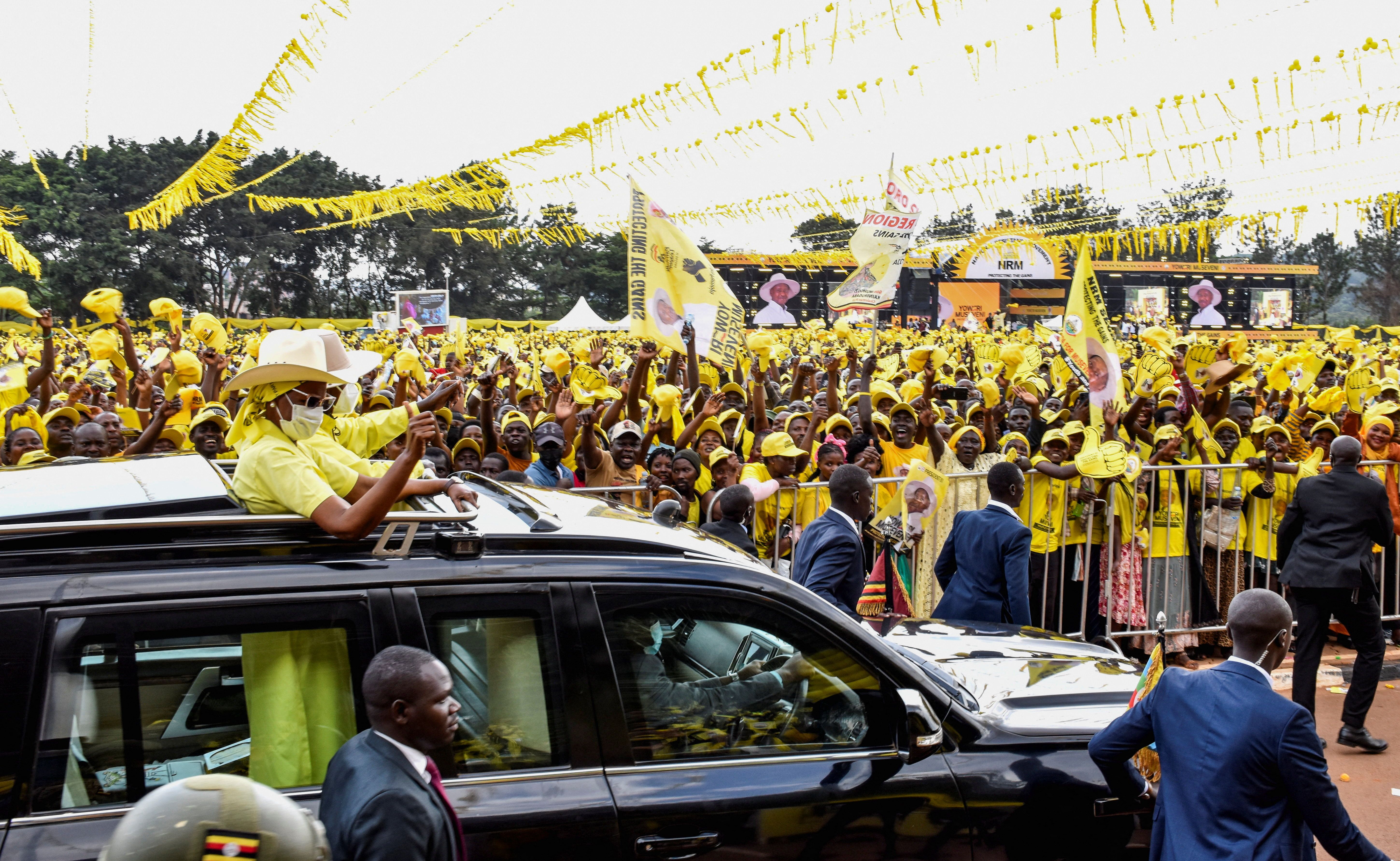Uganda’s President Yoweri Museveni, leader of the ruling National Resistance Movement (NRM) party, and his wife Janet arrive for his final rally ahead of the general election, in Kampala, Uganda.