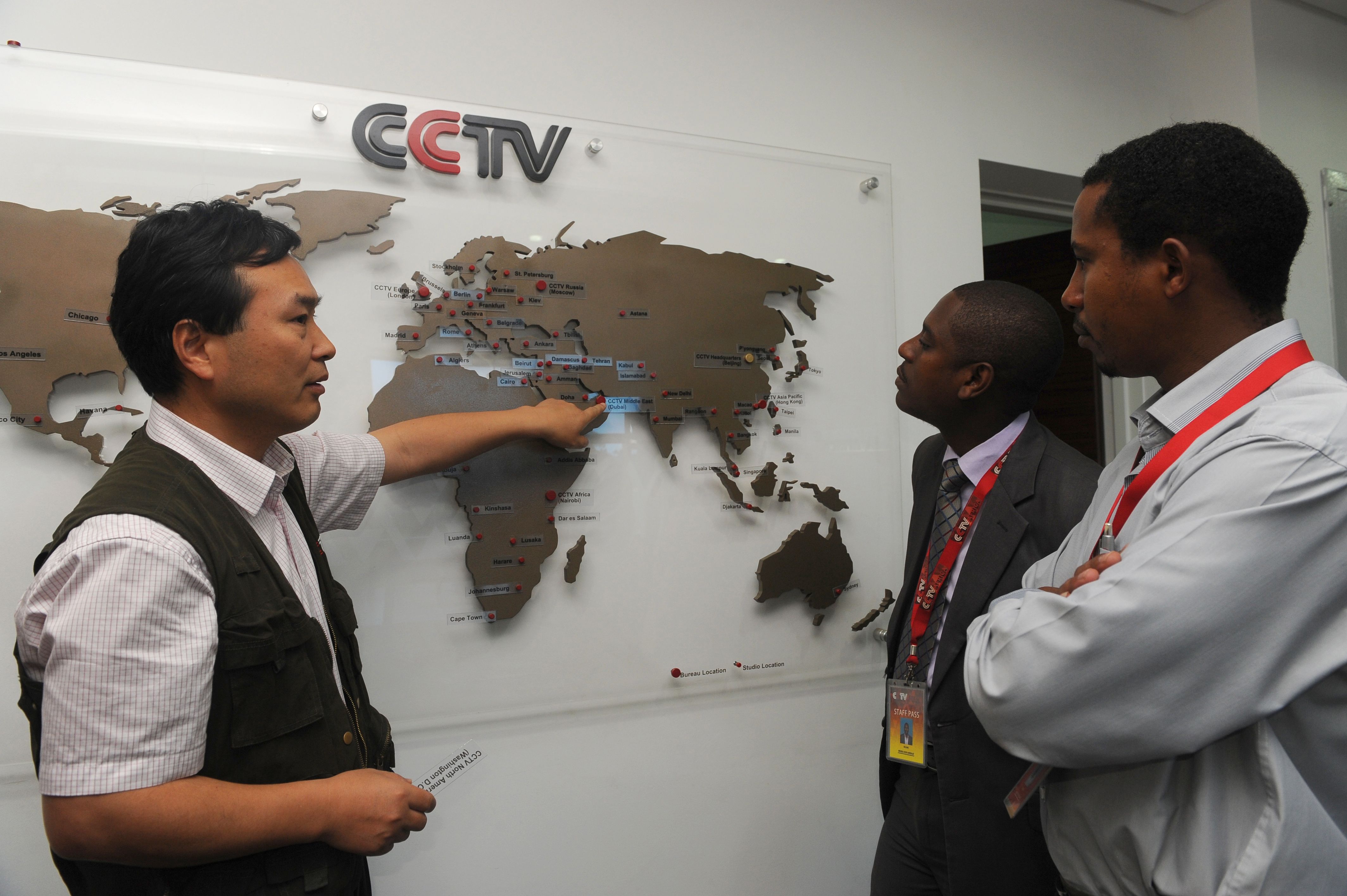 managing editor of China Central Television (CCTV) Africa Pang Xinhua (L) talking to local journalists in Nairobi.