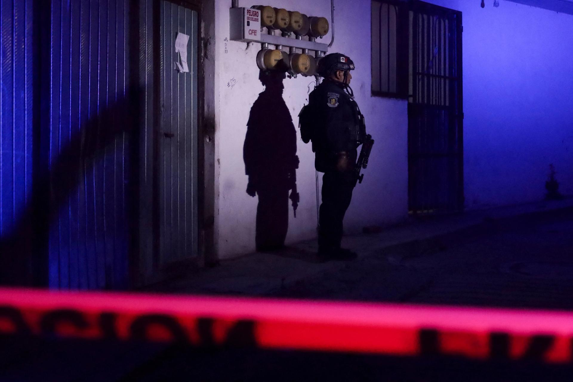 A member of the Mexican security forces stands as they respond at the scene where Alejandro Arcos, mayor of Chilpancingo, was killed.