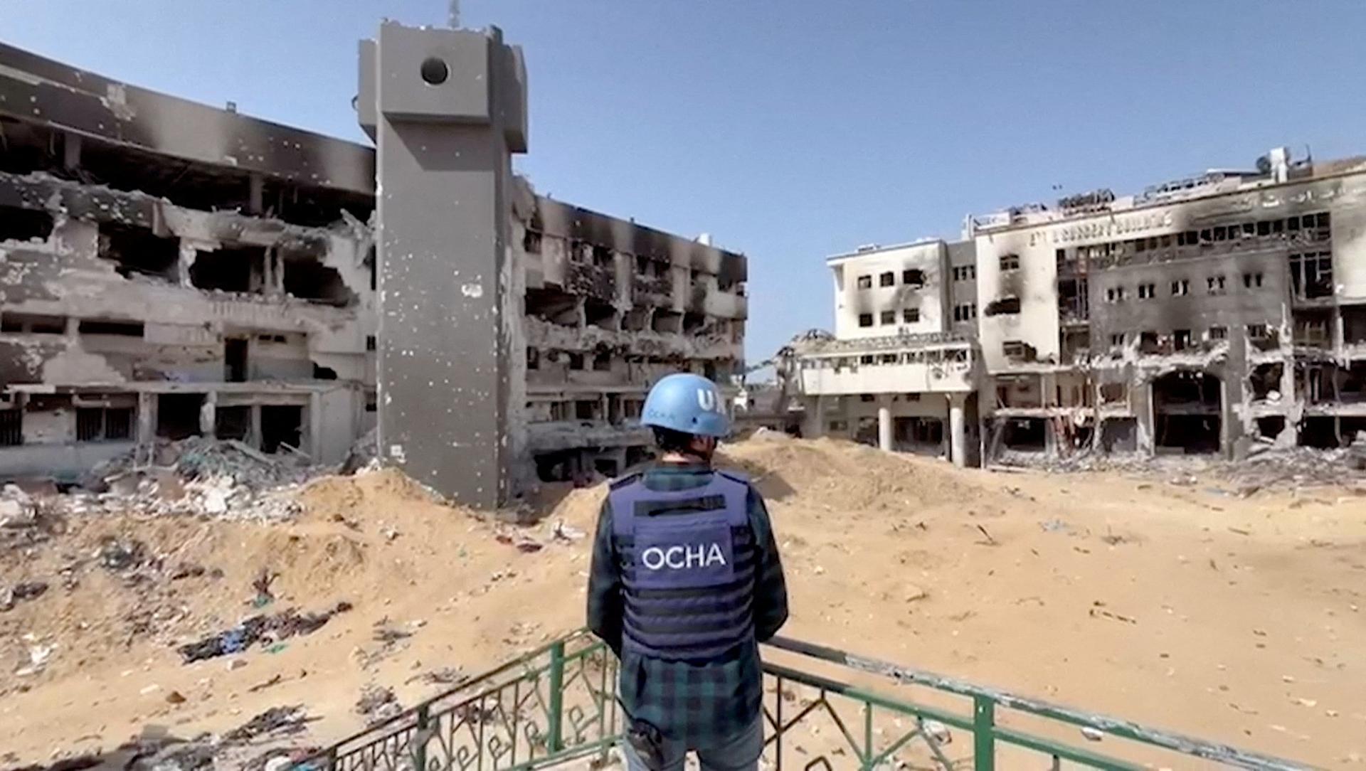 Jonathan Whittall, an OCHA official, stands near the destroyed Al Shifa Hospital during an assessment by a UN Convoy, amid the ongoing conflict between Israel and Hamas, in Gaza City, April 5, 2024, in this screen grab taken from a handout video. OCHA/Handout via REUTERS 