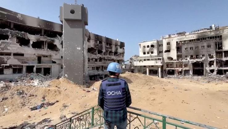 Jonathan Whittall, an OCHA official, stands near the destroyed Al Shifa Hospital during an assessment by a UN Convoy, amid the ongoing conflict between Israel and Hamas, in Gaza City, April 5, 2024, in this screen grab taken from a handout video. OCHA/Handout via REUTERS
