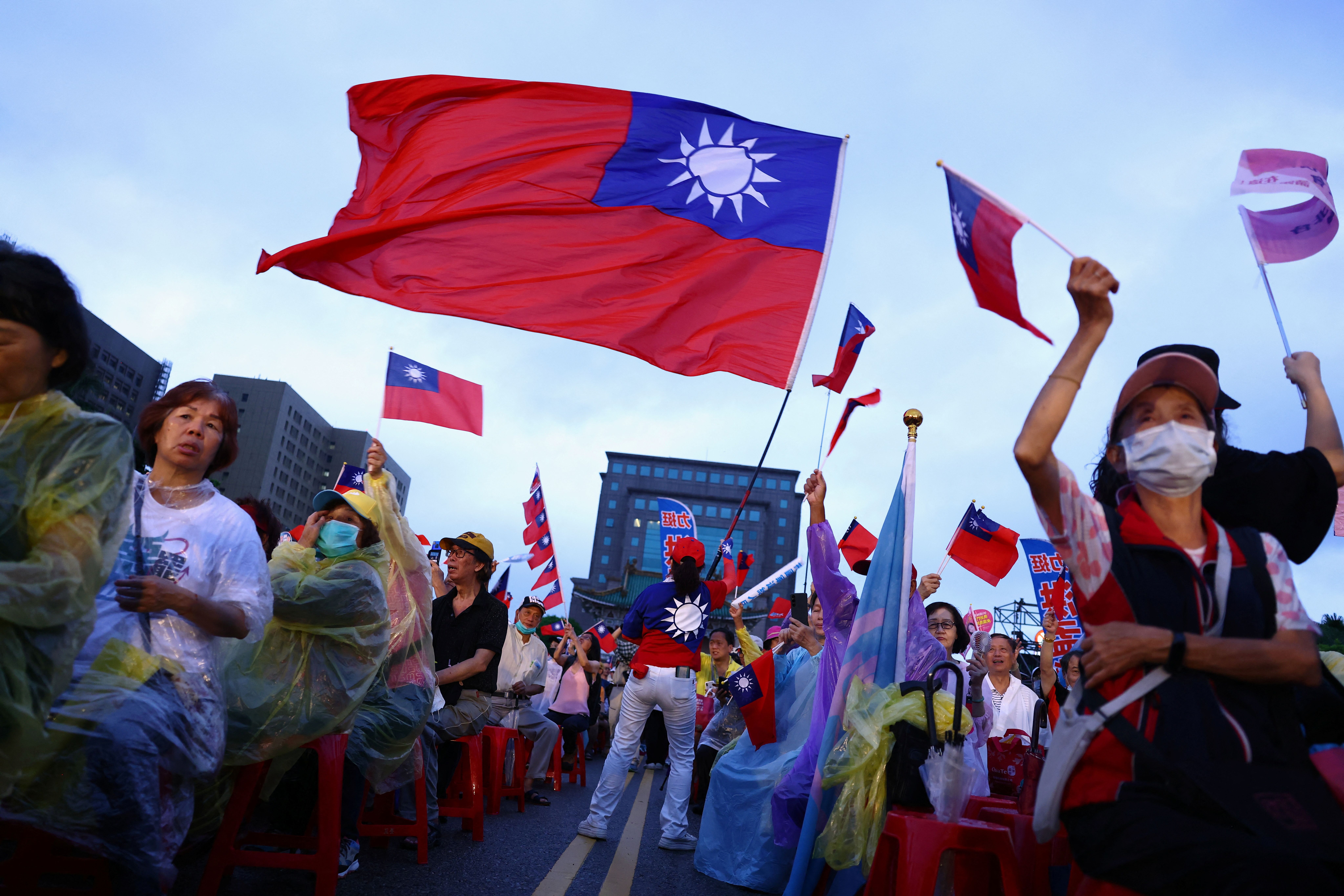 Supporters of Kuomintang (KMT) party attend a rally against the recall campaign.