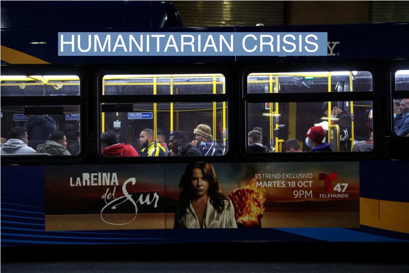Migrants transported from the U.S. border sit on a bus waiting for relocation after arriving at the Port Authority bus terminal in New York City, U.S., October 11, 2022. 