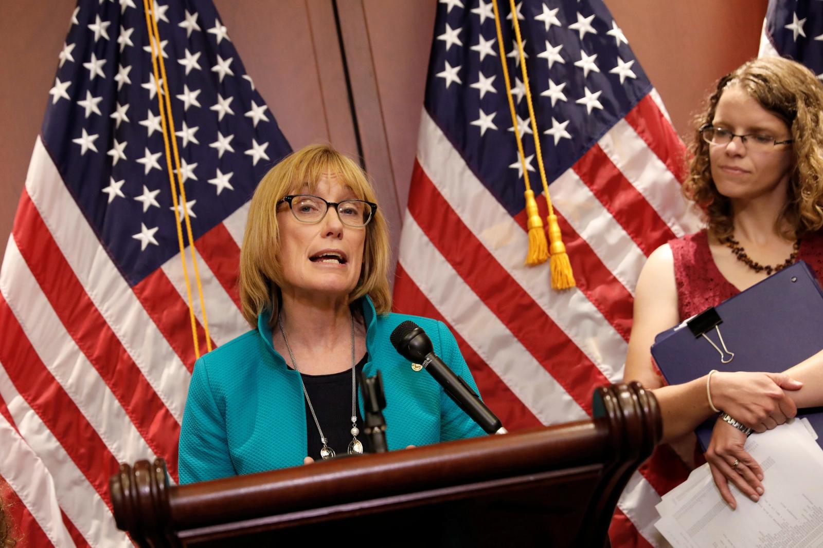 Sen. Maggie Hassan (D-NH), accompanied by children with preexisting conditions covered under the Affordable Care Act, speaks at a press conference about the Senate health care bill on Capitol Hill in Washington, U.S