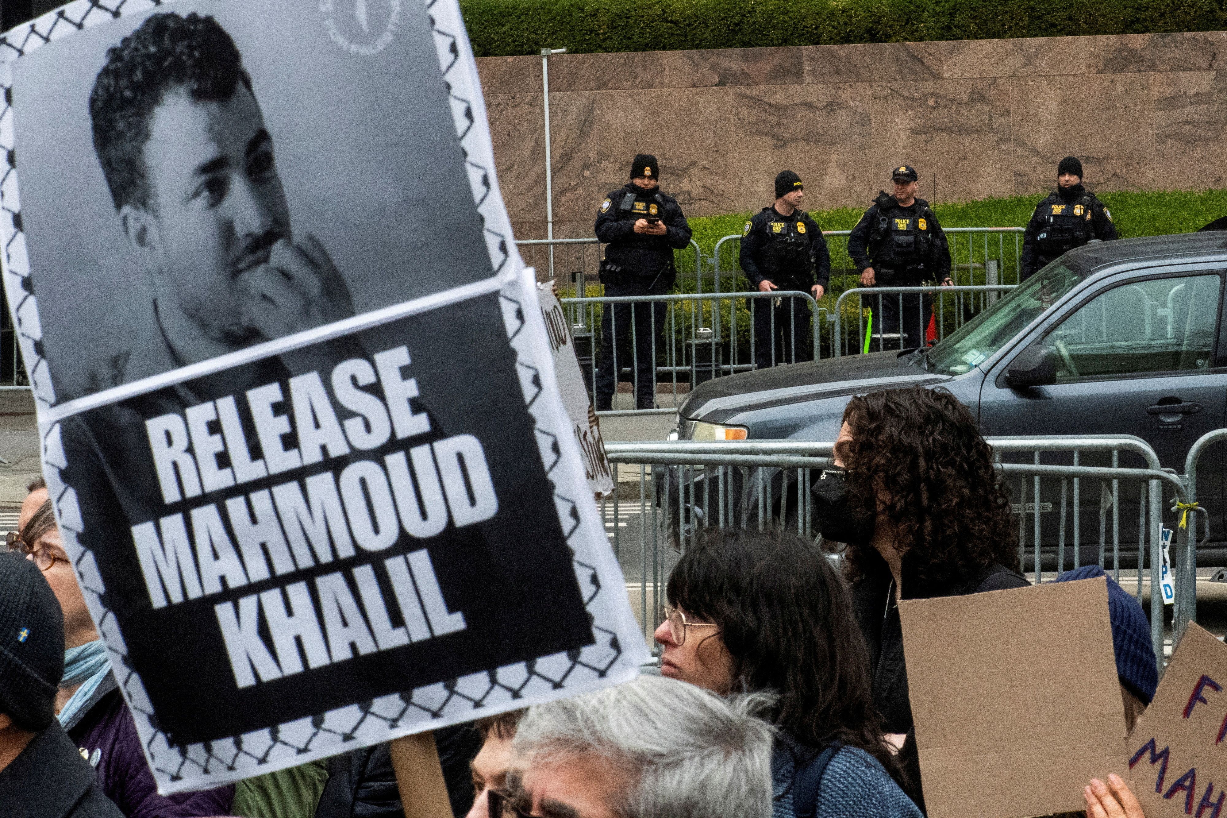 DHS police officers stand guard as protesters take part in a rally organized by Jewish activists against the detention by ICE agents of Palestinian activist and Columbia University graduate student Mahmoud Khalil in New York City.