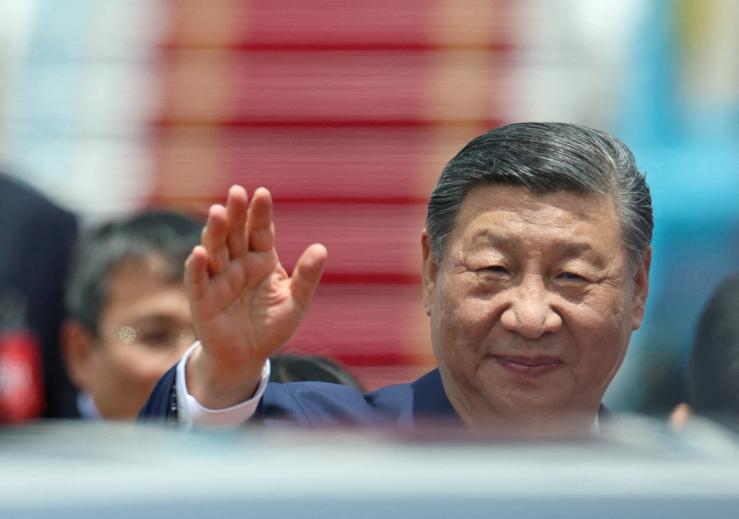 Chinese President Xi Jinping waves as he arrives for a two-day state visit, at Hanoi’s Noi Bai International Airport, Vietnam, April 14, 2025.