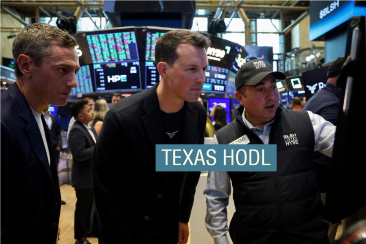 Brendan Blumer, Chairman of Bullish, and David Bonanno, CFO of Bullish, look at the price of the stock for Bullish during the company’s IPO