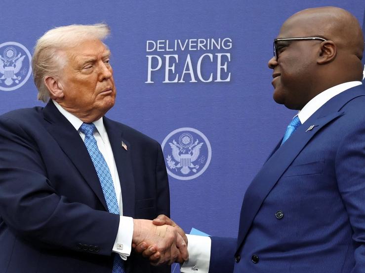 U.S. President Donald Trump shakes hands with President of the Democratic Republic of the Congo Felix Tshisekedi during a signing ceremony at the U.S. Institute of Peace in Washington, D.C., U.S., December 4, 2025.