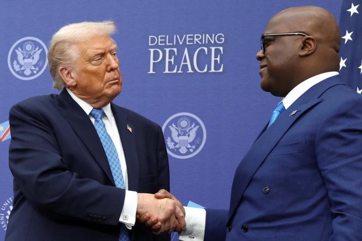U.S. President Donald Trump shakes hands with President of the Democratic Republic of the Congo Felix Tshisekedi during a signing ceremony at the U.S. Institute of Peace in Washington, D.C., U.S., December 4, 2025.