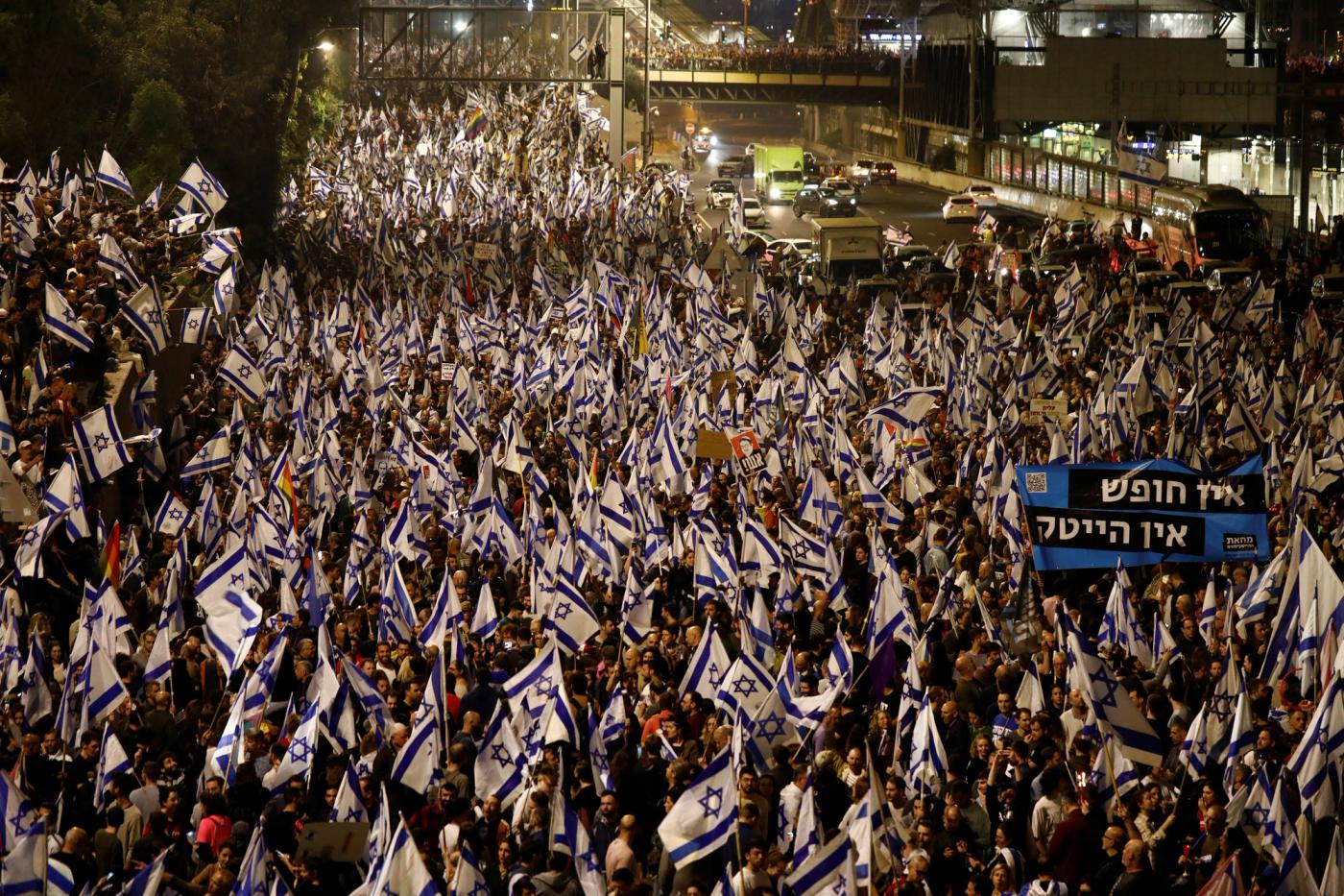 People attend a demonstration after Israeli Prime Minister Benjamin Netanyahu dismissed the defense minister and his nationalist coalition government presses on with its judicial overhaul, in Tel Aviv, Israel, March 26, 2023. REUTERS/Nir Elias