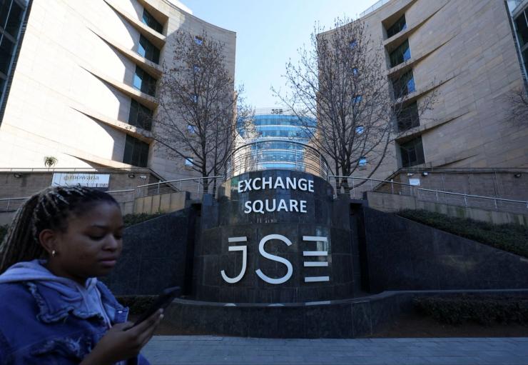 A woman walks at the Johannesburg Stock Exchange.