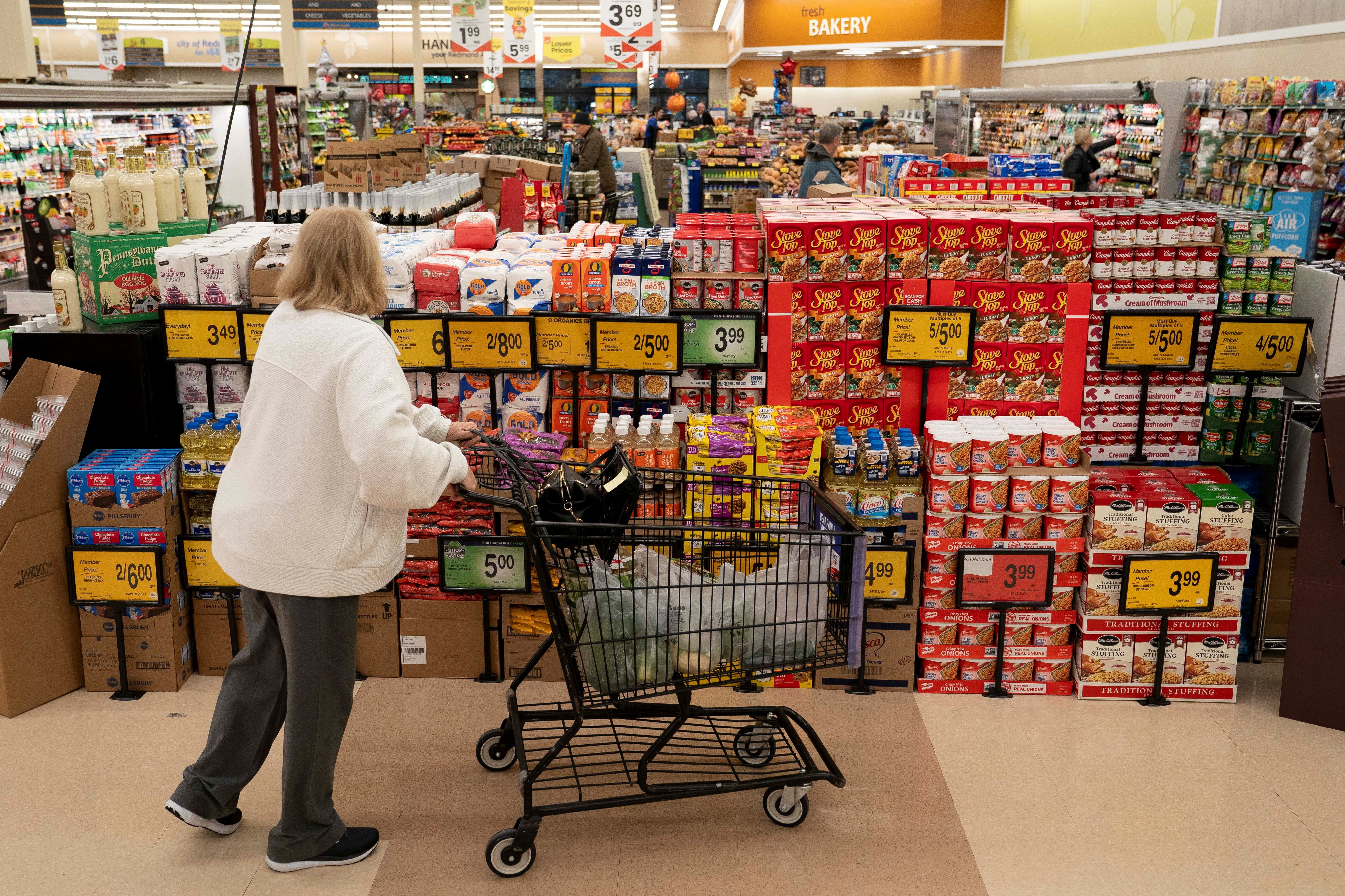 A shopper browses a holiday food display