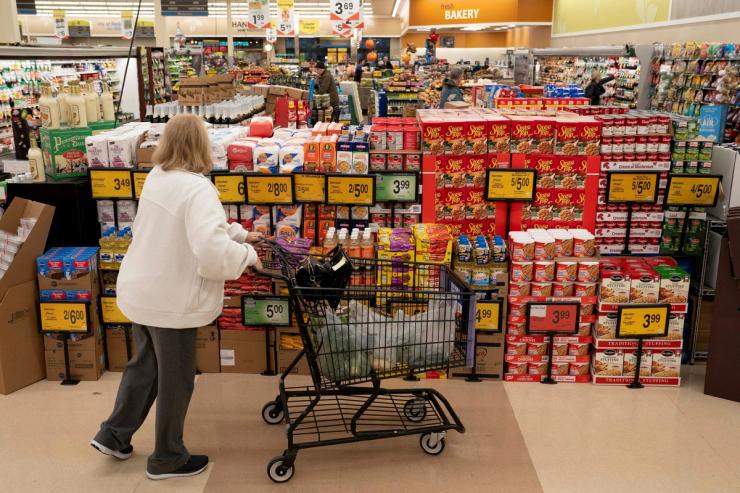 A shopper browses a holiday food display