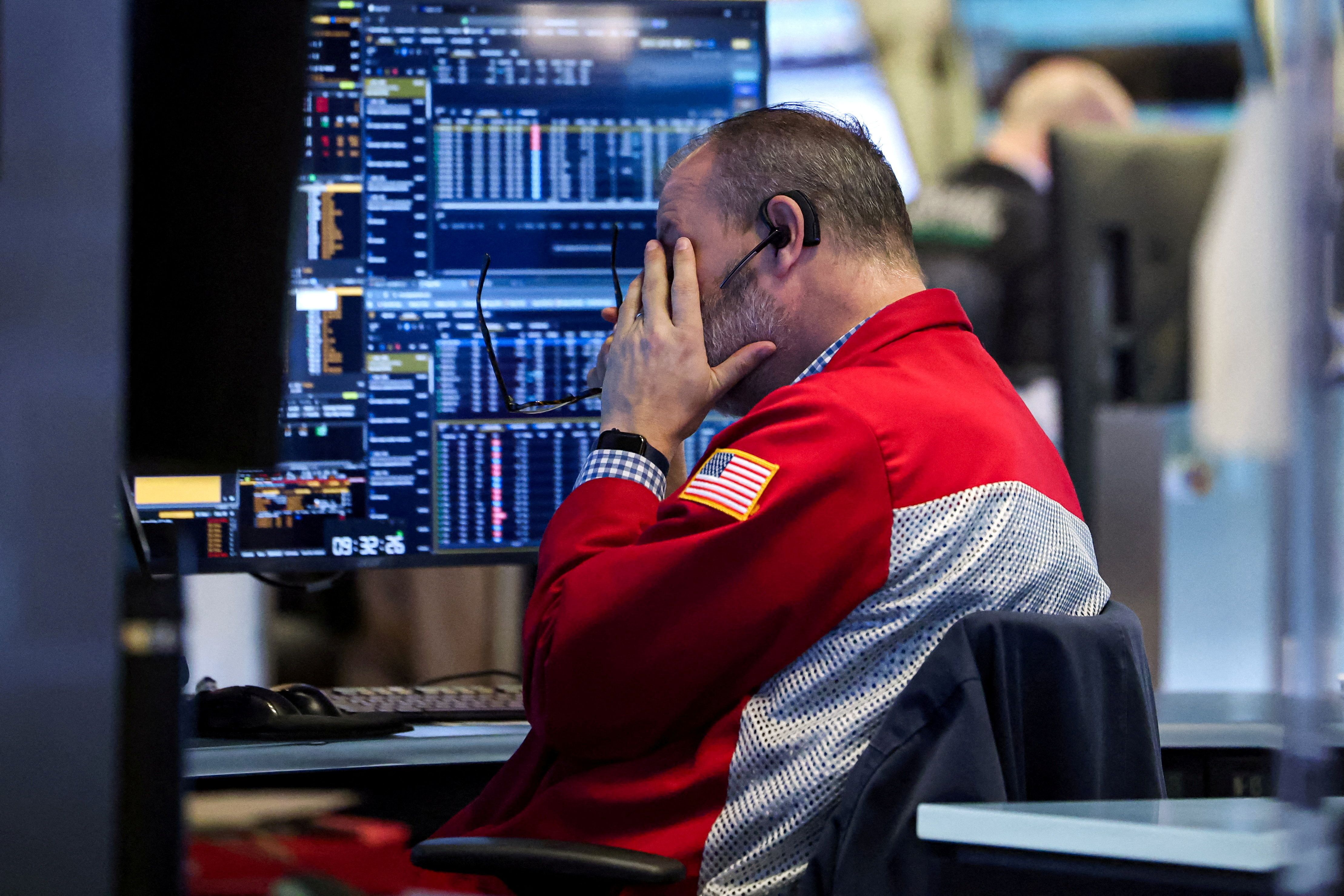 A trader works on the floor at the New York Stock Exchange