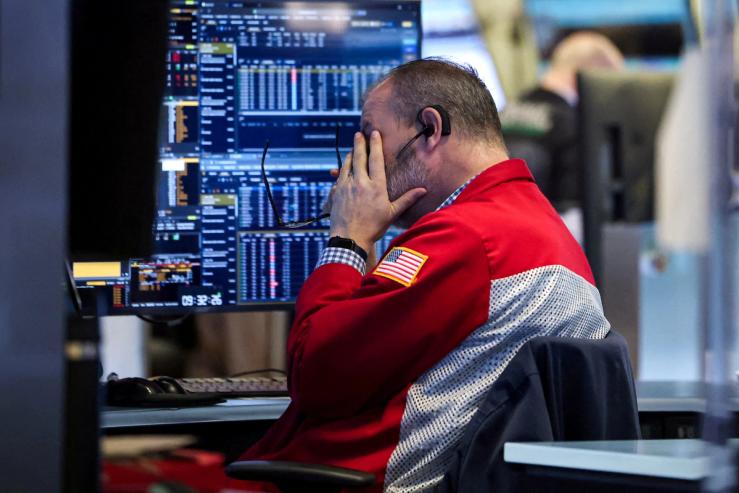 A trader works on the floor at the New York Stock Exchange