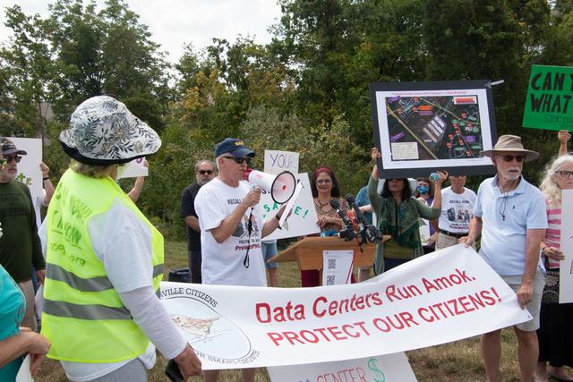 People protesting against data center buildouts.