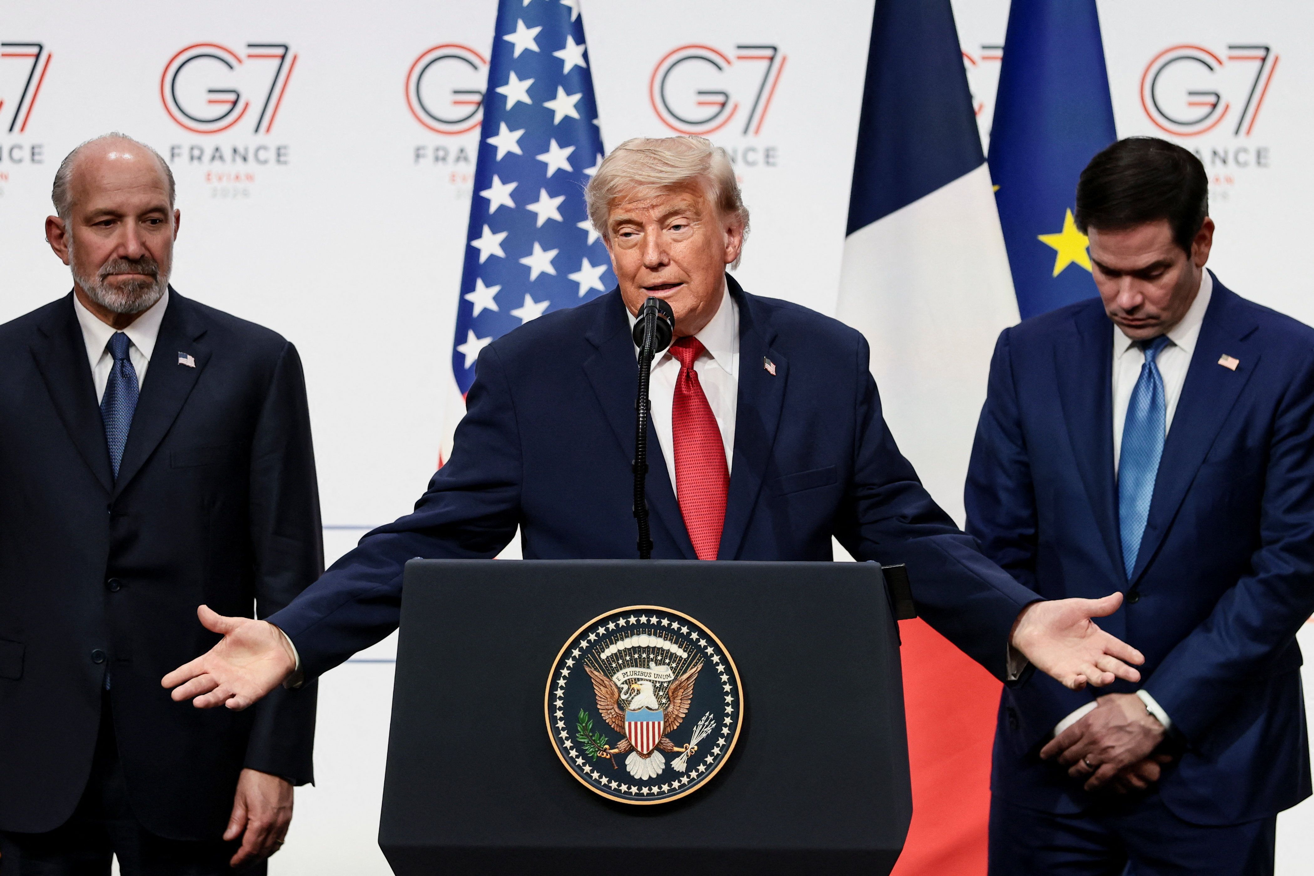 President Donald Trump, with Commerce Secretary Howard Lutnick and Secretary of State Marco Rubio, holds a press conference during the G7 Summit
