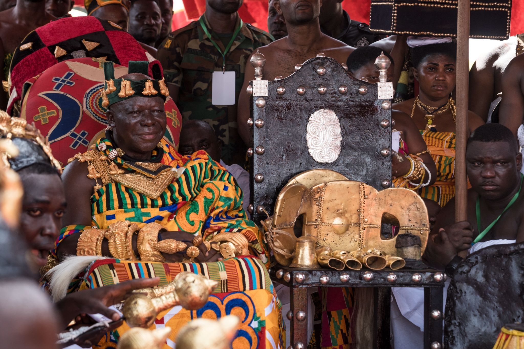 The Asantehene, Otumfuo Osei Tutu II, sits in state in 2024 next to the Sika Dwa Kofi, known as the Golden Stool, the ultimate symbol of power in Asante. 