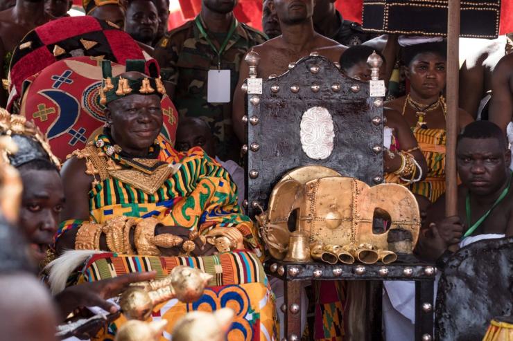 The Asantehene, Otumfuo Osei Tutu II, sits in state in 2024 next to the Sika Dwa Kofi, known as the Golden Stool, the ultimate symbol of power in Asante.