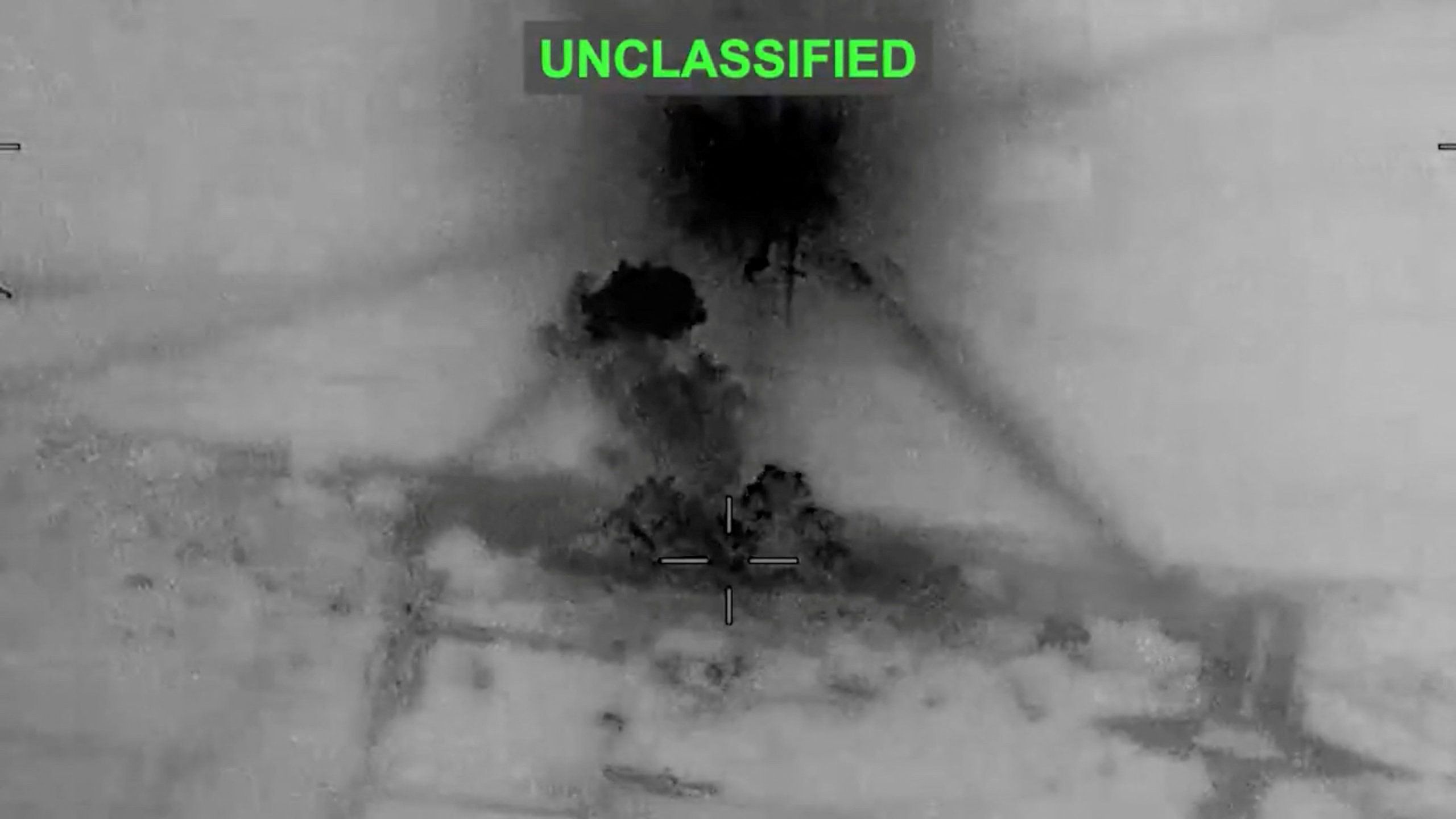 Smoke rises from explosions at an unknown location, following what CENTCOM said were strikes on Iran
