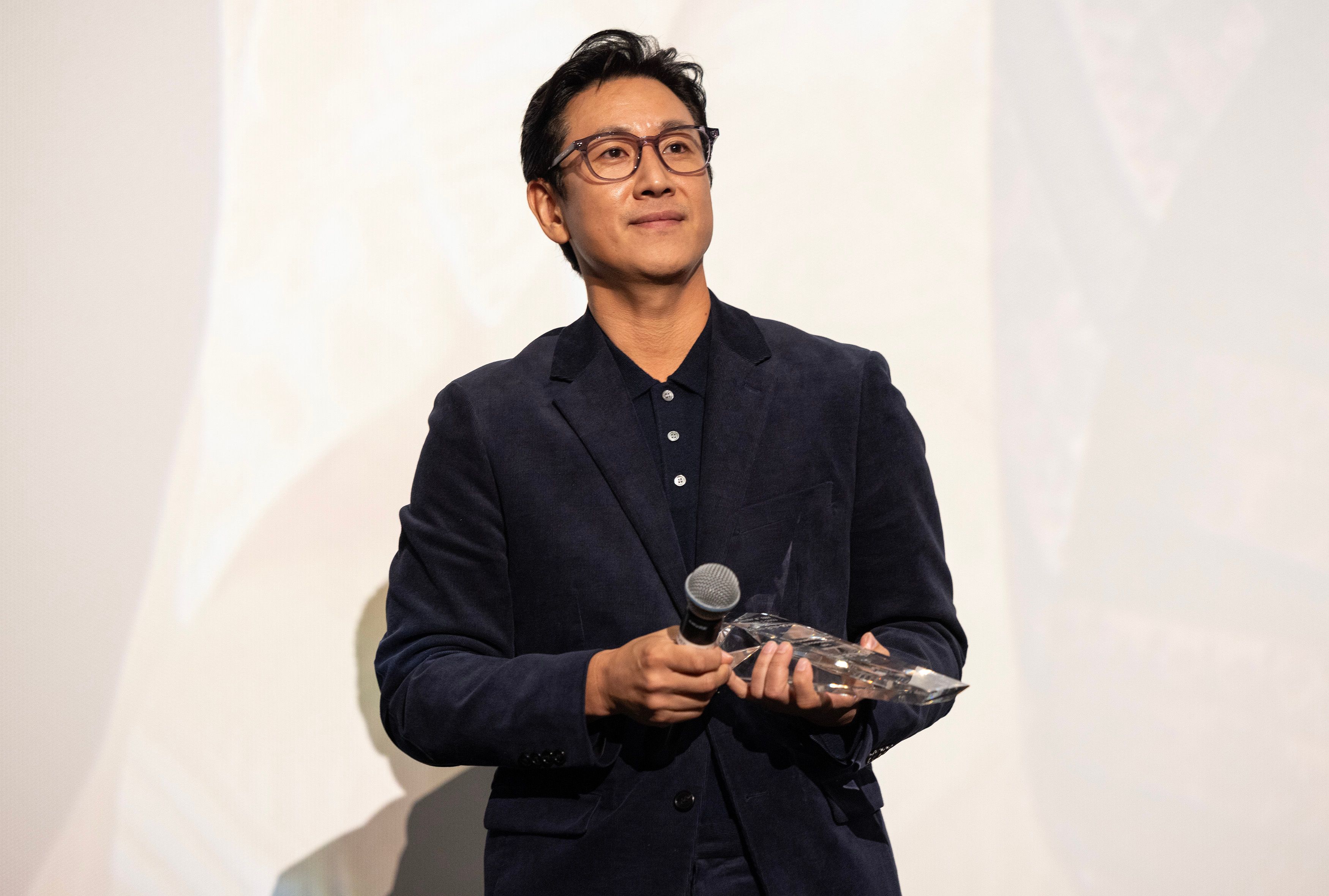 Actor Lee Sun Kyun receives the award for “Excellent Achievement in Film” during the introduction of the “Killing Romance” Midwest premiere at AMC New City 14 on October 07, 2023 in Chicago, Illinois.