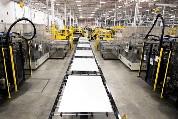 An assembly line moves solar panels through manufacturing at First Solar in Perrysburg, Ohio July 8, 2022.