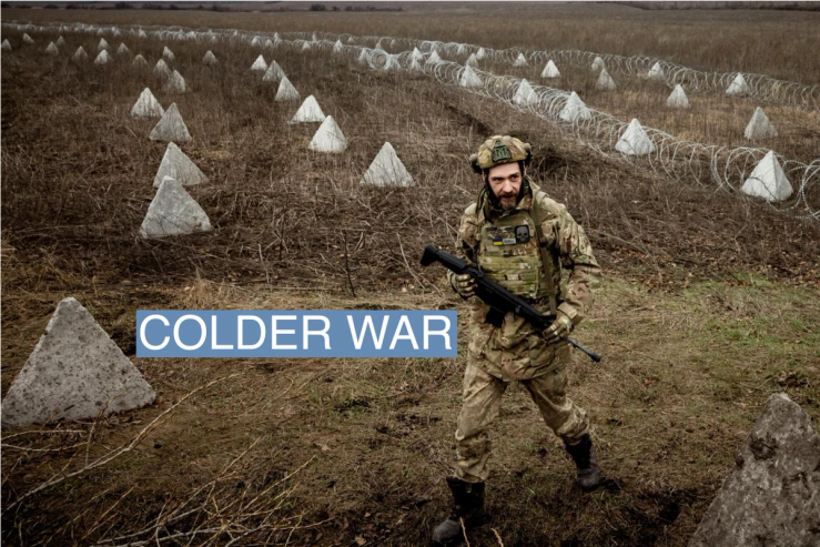 Ukrainian military engineer with the call sign “Lizard” walks near fortifications, including “dragon’s teeth” and barbed wire, that he helped to build in a field near the front line outside Kupiansk, amid Russia’s attack on Ukraine, December 28, 2023. REUTERS/Thomas Peter