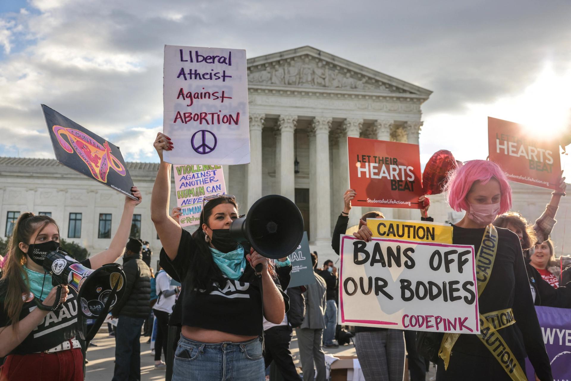 Pro-choice and anti-abortion both demonstrate outside the United States Supreme Court as the court hears arguments over a challenge to a Texas law that bans abortion after six weeks in Washington, D.C., on Nov. 1, 2021