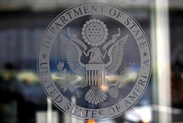 A logo of the US State Department.