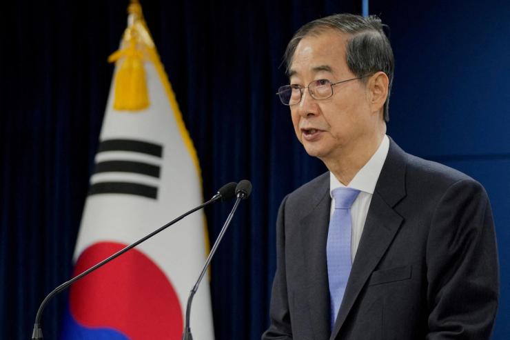 South Korean acting President Han Duck-soo speaks during a briefing at the Government Complex in Seoul, South Korea.