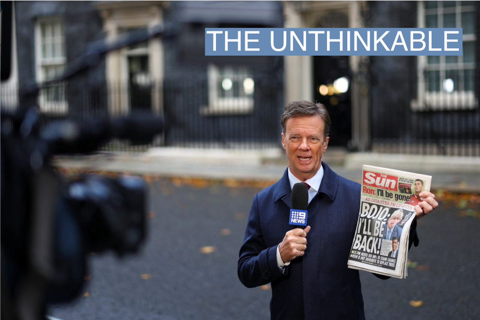 A 9NEWS reporter holds a copy of The Sun newspaper, with former British Prime Minister Boris Johnson on the cover, outside 10 Downing Street in London, Britain October 21, 2022. 