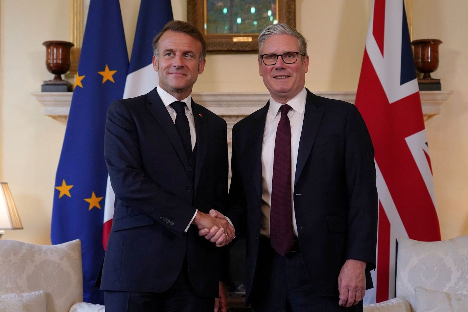 Britain’s Prime Minister Keir Starmer shakes hands with French President Emmanuel Macron.