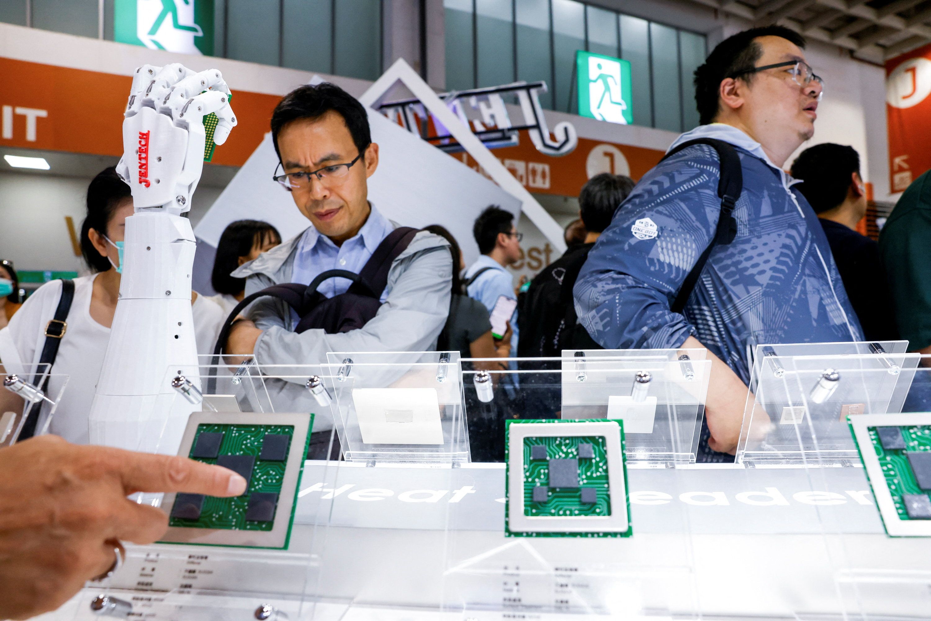 People visit the Jentech Precision Industrial booth during the annual Computex trade show in Taipei, Taiwan.