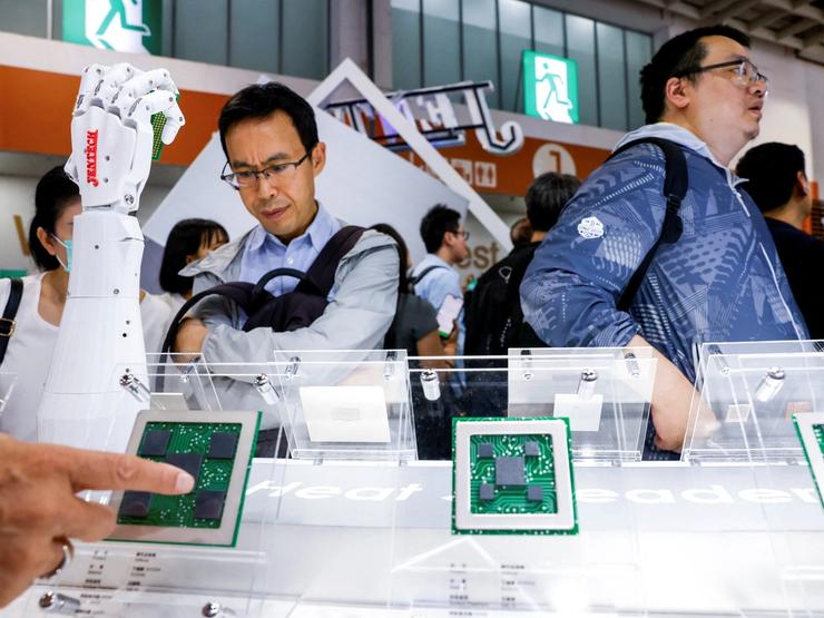 People visit the Jentech Precision Industrial booth during the annual Computex trade show in Taipei, Taiwan.