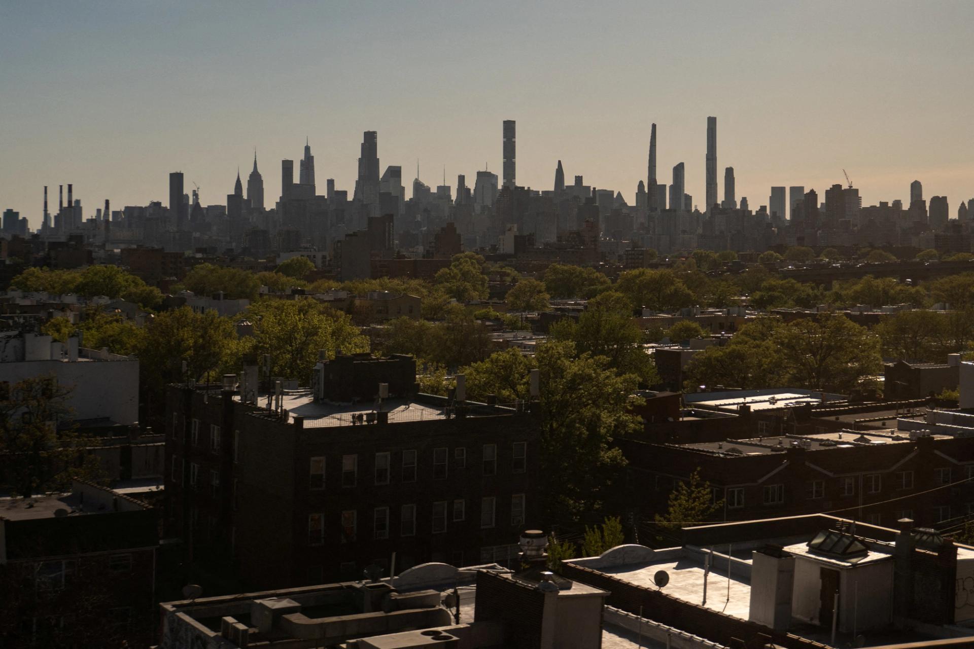 The Manhattan skyline is seen from Queens, New York.
