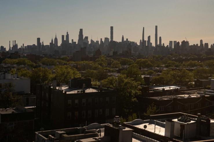 The Manhattan skyline is seen from Queens, New York.
