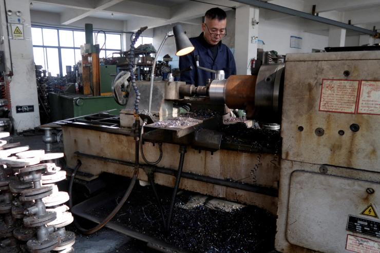 An employee works on a production line in China.